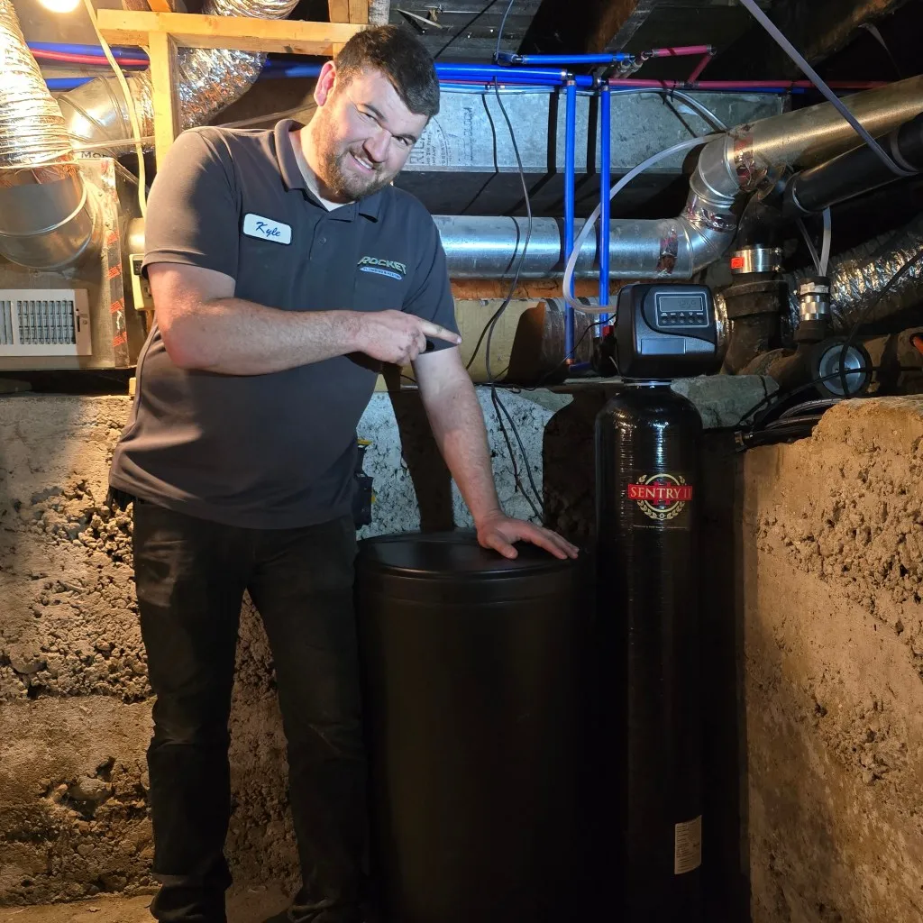 Kyle Bashford installing a Sentry II water softener